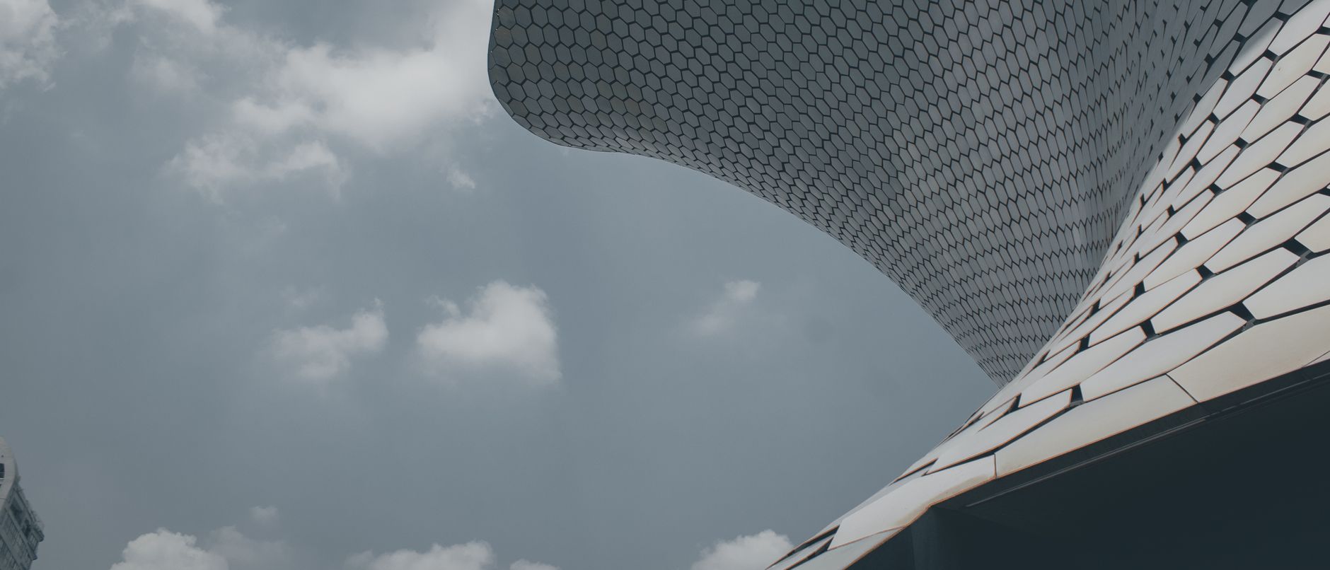 Low-angle view of the Museo Soumaya's modern architecture in Mexico City.